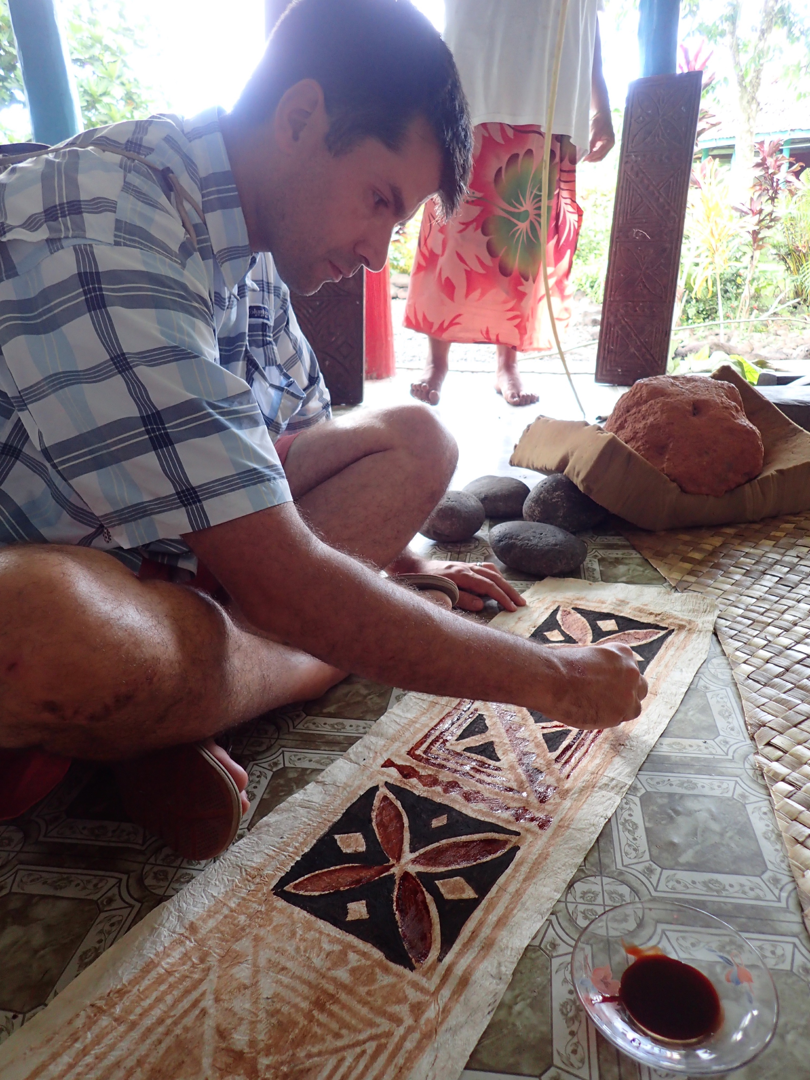 MOANA story artist, David Derrick, learns tapa painting during a research trip.