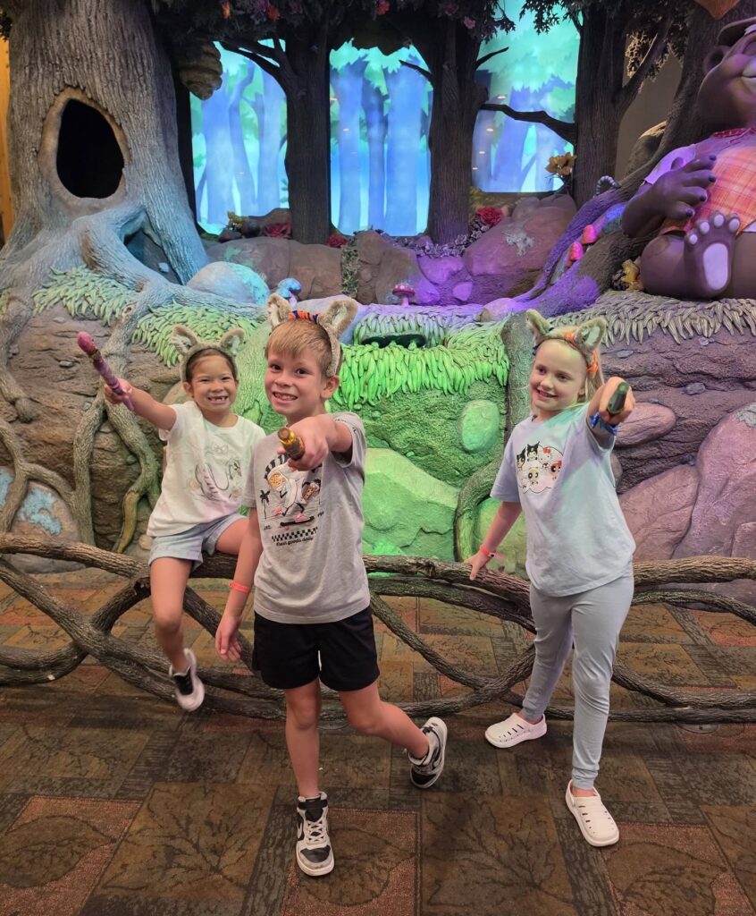 Kid exploring Great Wolf Lodge while playing the interactive MagiQuest game.